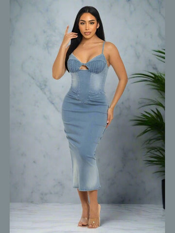 Denim midi dress with a fitted silhouette, sleeveless design, and back zipper closure. Made from 100% cotton for a comfortable, casual look.