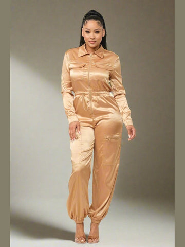 Close-up of the Pop of Gold Jumpsuit, focusing on the satin fabric and zipper detail.