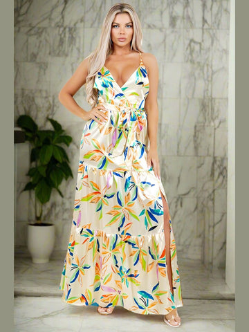 Model wearing the Star Gazing Maxi Dress in Yellow, emphasizing the playful cut-off front side and flowing design