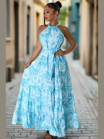 Model in the Summer Fling Maxi Dress in Blue, featuring a self-strip neck back design, exuding elegance and sophistication