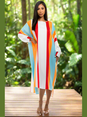 Model wearing the Tropical Temptation Long Maxi Dress, showcasing the vibrant print and halter neckline