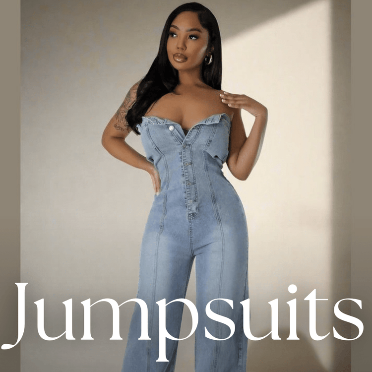 Stylish strapless denim jumpsuit with a fitted bodice and wide-leg pants, featuring distressed details. Perfect addition to our Jumpsuits & Rompers collection for a chic and effortless look.