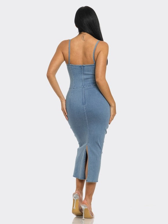 Denim midi dress with a fitted silhouette, sleeveless design, and back zipper closure. Made from 100% cotton for a comfortable, casual look.
