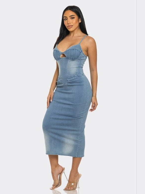 Denim midi dress with a fitted silhouette, sleeveless design, and back zipper closure. Made from 100% cotton for a comfortable, casual look.
