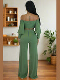 Sweet Harmony Two-Piece Set - Elegant women's fashion set with cropped top and high-waisted pants, perfect for casual or evening wear. Model facing backward