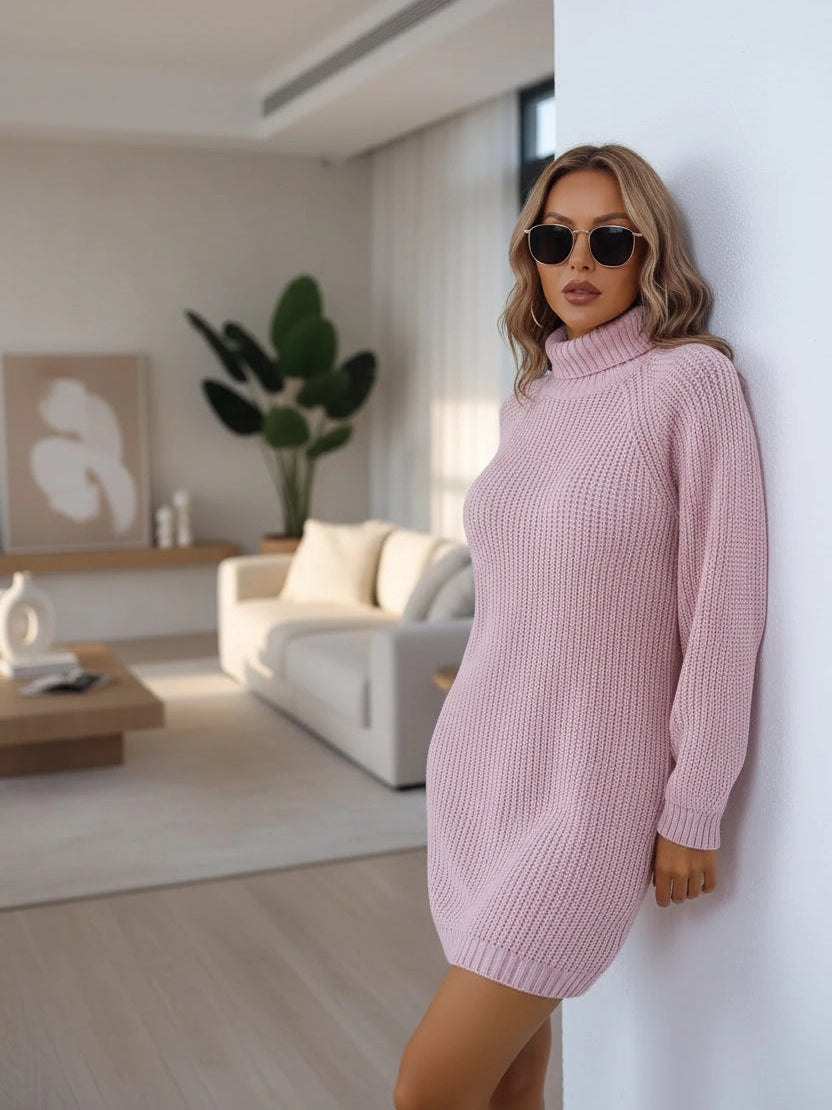 Woman wearing a pink knitted dress against a white background