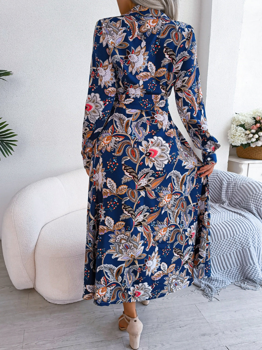 Side view of the With Flare Tied Printed Midi Dress, showcasing the flared design and tied waist detail.