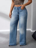 Close-up of the bottom half of the Exude Wide Leg Jeans showcasing the wide-leg fit and frayed hem detail