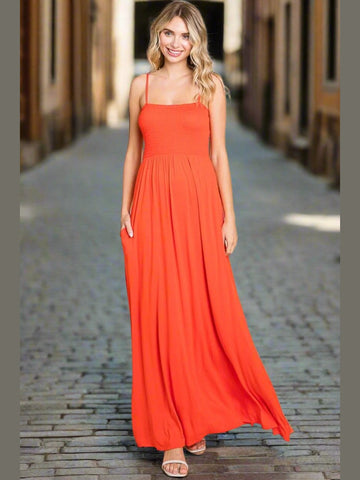 Model in the Summer Breeze Cami Maxi Dress in Orange, featuring adjustable straps and a relaxed fit.