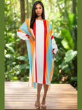 Model wearing the Tropical Temptation Long Maxi Dress, showcasing the vibrant print and halter neckline